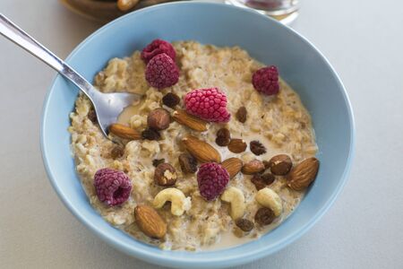 oatmeal with nuts and raspberriesの写真素材