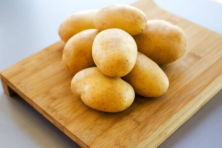 close up potatoes on kitchen tableの写真素材