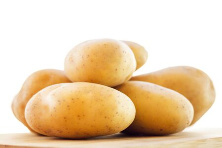 close up potatoes on kitchen tableの写真素材