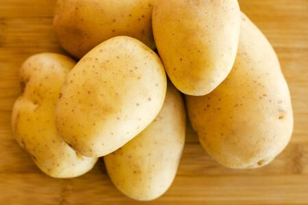 close up potatoes on kitchen tableの写真素材