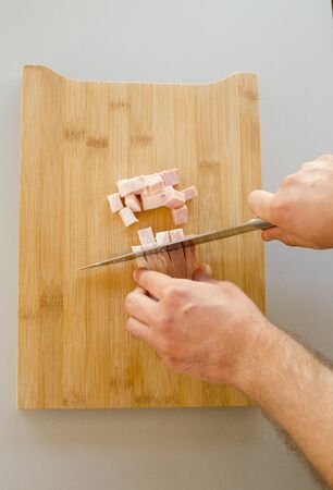 Chopped bacon close up in the kitchen tableの写真素材