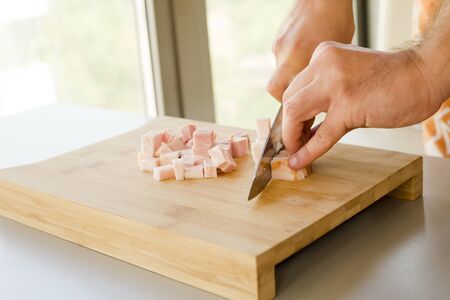Chopped bacon close up in the kitchen tableの写真素材