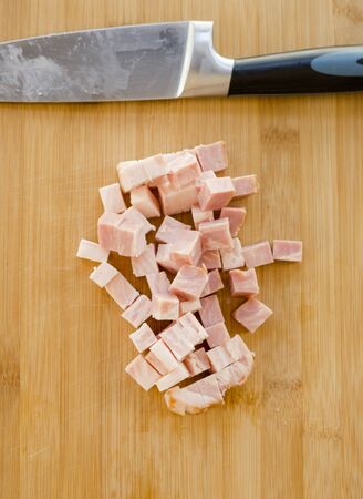 Chopped bacon close up in the kitchen tableの写真素材