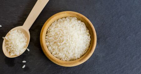 Raw rice on the table close upの写真素材