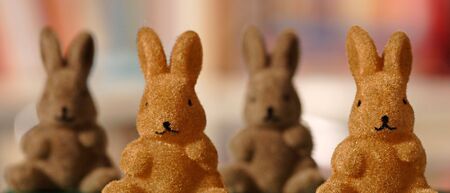 Four bunny figures in a rowの写真素材