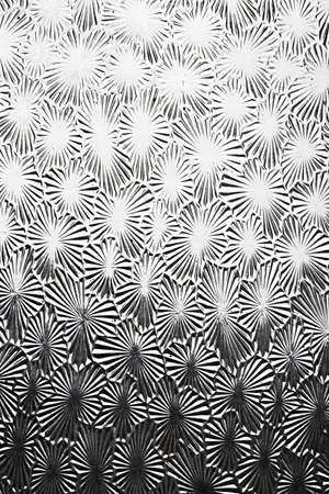 Old glass plate with star shaped ornaments showing some imperfectionsの写真素材