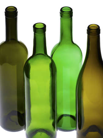 Backlit empty wine bottles on white backgroundの写真素材