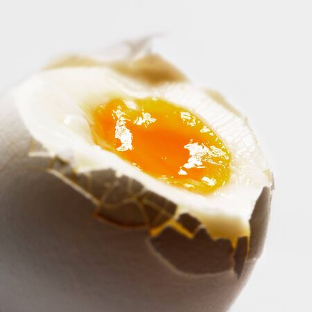 Cracked boiled egg close up