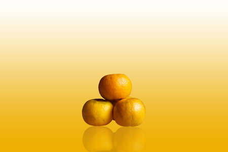 Three orange isolated on backgroundの写真素材