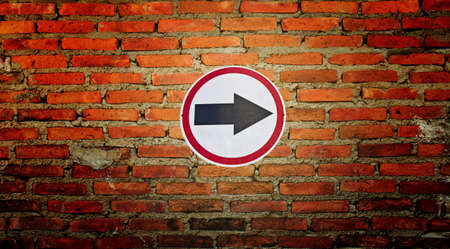 Traffic road sign isolated on wall の写真素材