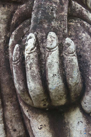 stone hands in a prayer の写真素材