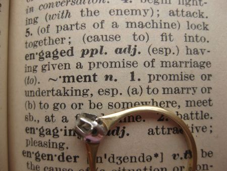 engagement ring on dictionary