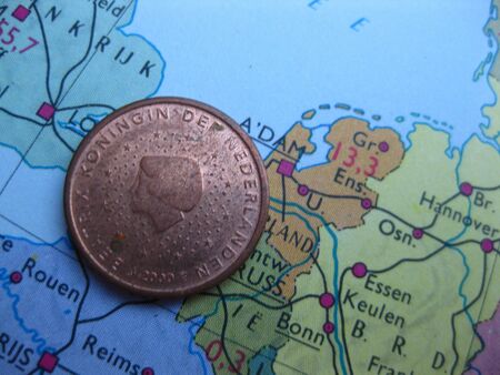 Coin on vintage map: 5 euro cent from the Netherlandsの写真素材