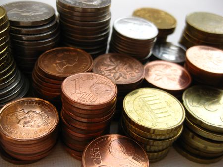 Stack of coins from Canada and Europe