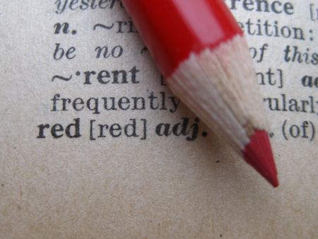 the dictionary: pencil on redの写真素材