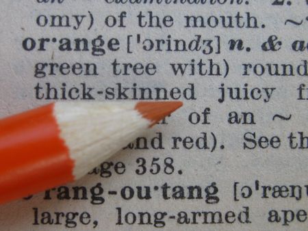 the dictionary: pencil on orangeの写真素材