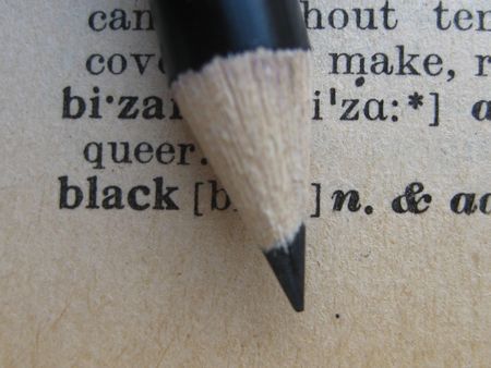 the dictionary: pencil on blackの写真素材