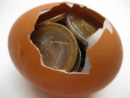 Eurocoins in an eggの写真素材