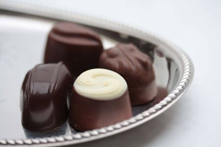 Belgium chocolate pralines on silver plateの写真素材