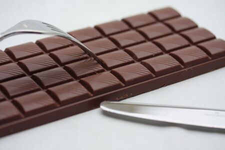 Chocolate bar and cutleryの写真素材