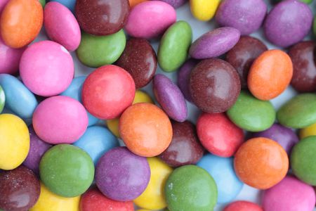 colored candies - smartiesの写真素材