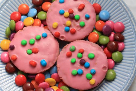 Pink glaced cupcakes with colored sprinkles - Childrens party