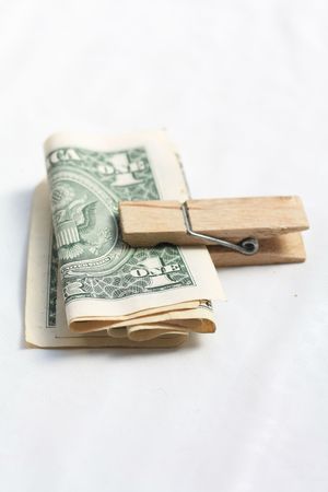 Clipped money, dollar notes in a laundrey pegの写真素材