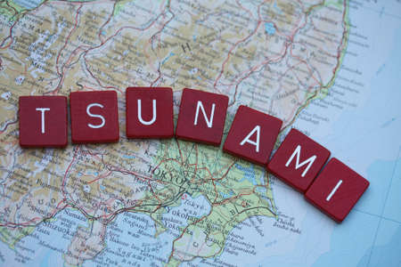 march 11th 2011  Map of Tokyo, Japan, with word Tsunami in red blocksのeditorial素材