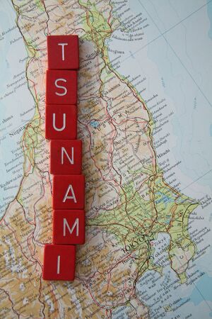 march, 11th 2011 Tsunami in Japan, map of Japan with Tsunami spelled in red lettersのeditorial素材
