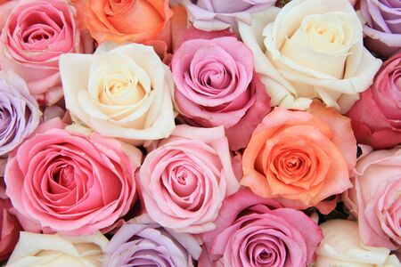 Bridal flower arrangement with roses in many pastel colorsの写真素材