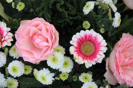 Various flowers in a mixed pink and white floral arrangement