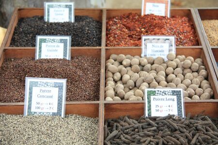 Different sorts of pepper and other spices on a french marketのeditorial素材