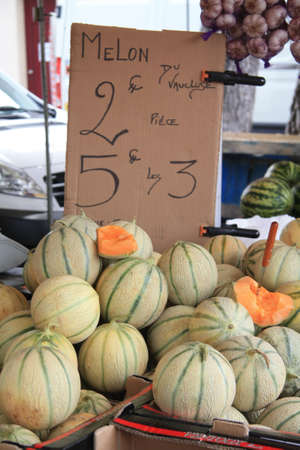 Big fresh melons on a local marketの写真素材