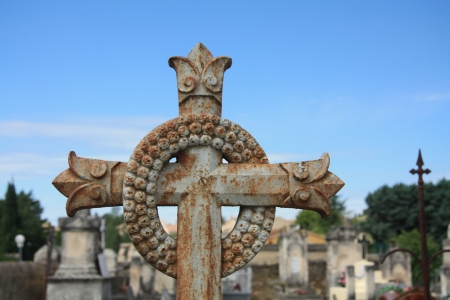 Cast iron grave ornament, cross and wrench on an old cemetery in the Provence, Franceの写真素材