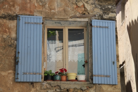 French style window with painted wooden shuttersの写真素材