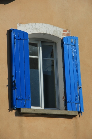 French style window with painted wooden shuttersの写真素材