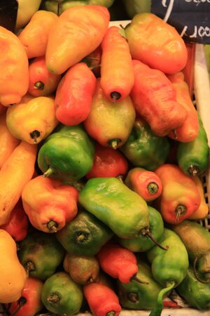 Yellow, orange and green peppers at the market