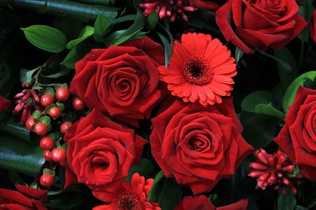 Red flower arrangement with roses and gerberasの写真素材
