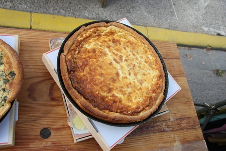 Fresh baked pizza, displayed on a wooden table