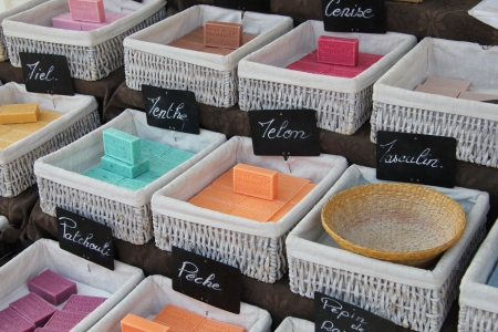 Bars of soap in many different colors at a market in the Provence, Franceのeditorial素材