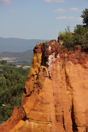 Ochre colored rocks in Roussillon in the South of Franceの写真素材