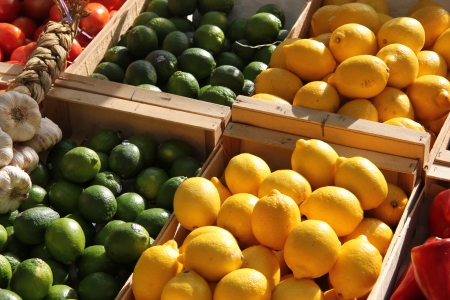 yellow and green lemons at a French marketの写真素材