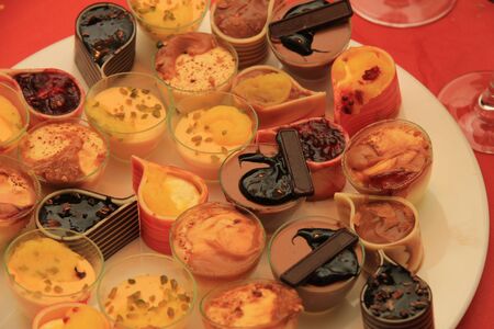 Luxury dessert servings in various shapes and with colorful decorations