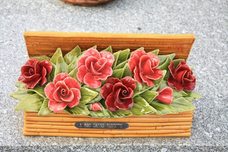 Ceramic sympathy flowers at a French graveyardの写真素材