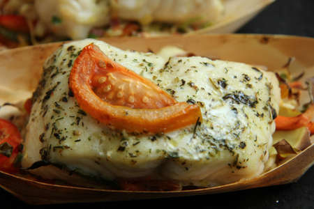 Grilled wolffish fillet with tomato and herbs
