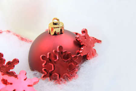 Red christmas decorations: ice crystal on a ballの写真素材