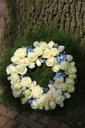 sympathy wreath with white roses and blue hydrangheaの写真素材