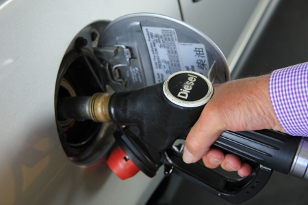 Pumping gas at a self service gas station