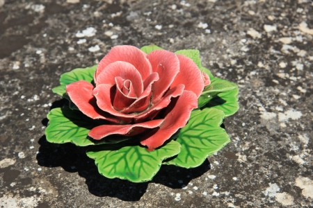 Pink rose, ceramic grave flowers at a French cemetaryの写真素材