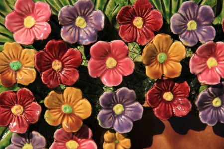 Ceramic grave flowers at a thombstone in Franceの写真素材